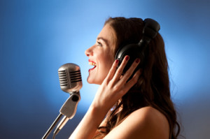 blonde_girl_singing_in_recording_studio